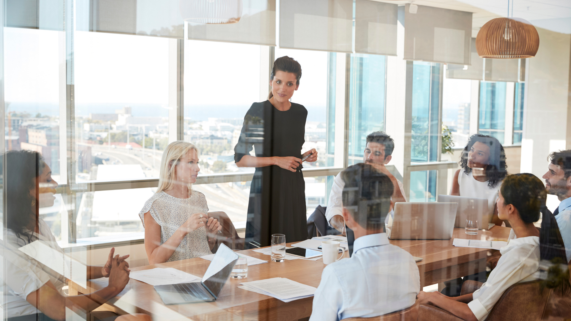 Confident businesswoman leading a team meeting at work